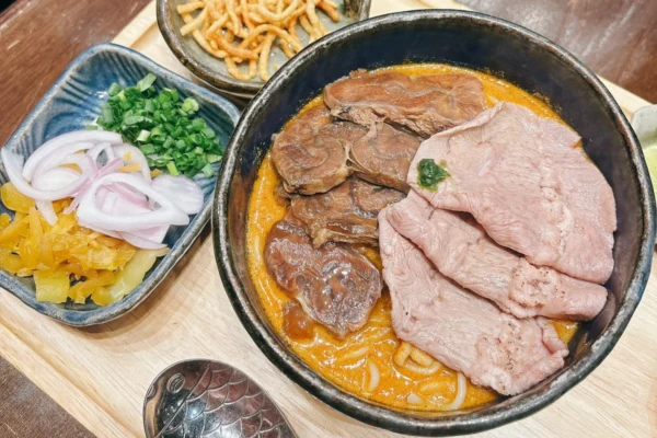 Khao Soi is a famous Thai food with soft noodle and crisp noodle from northern region of Thailand