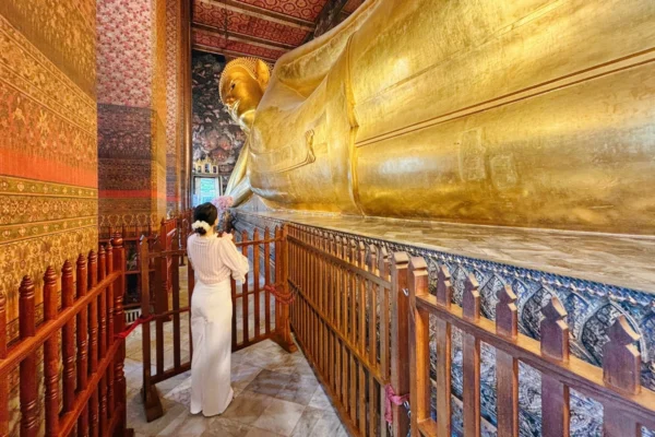 Wat Pho The Reclining Buddha Temple in Bangkok Thailand with the big stunning buddha in the hall decorated by painting